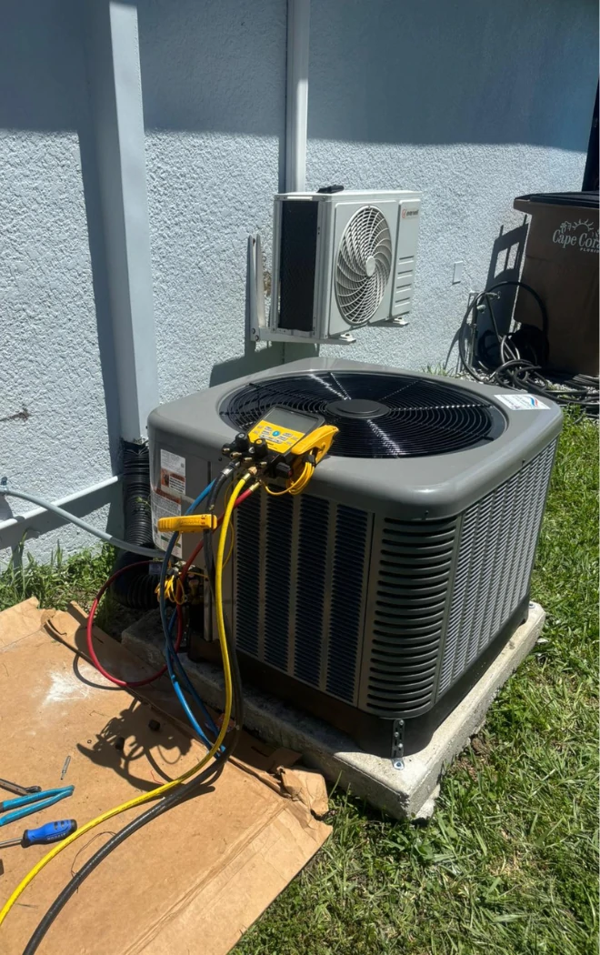 Air conditioning condenser repair with gauges connected in Cape Coral